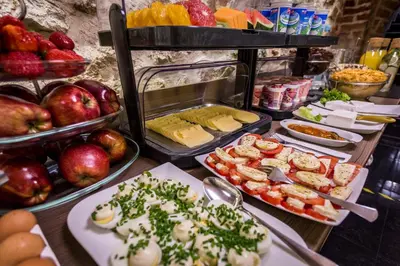 a buffet with many different types of food on display at Hotel Elektor Premium in Kraków