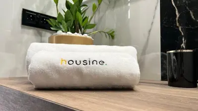 a towel with the word hospice written on it on a table at Boutique 78 by Housine in Zator