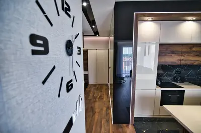 a kitchen with a clock on the wall at Boutique 78 by Housine in Zator