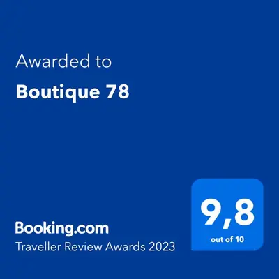 a blue calculator with the text awarded to boulder at Boutique 78 by Housine in Zator