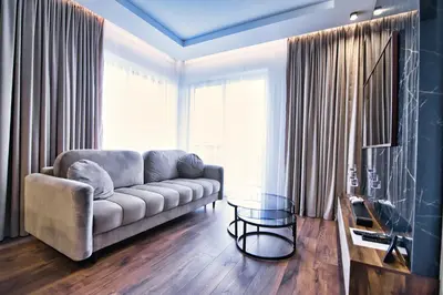 a living room with a couch and a table at Boutique 78 by Housine in Zator