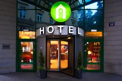 a hotel sign on the front of a building at CAMPANILE PRIME Krakow Old Town in Kraków