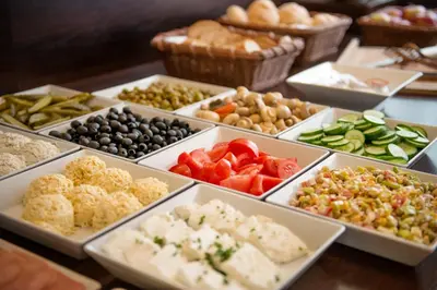 a buffet of different types of food on a table at Hotel Krakus in Kraków
