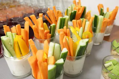 a group of cups filled with carrots and vegetables at Hotel Krakus in Kraków