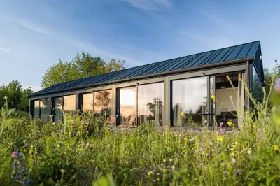 a glass house with a solar roof at Domki na Łące in Libiąż