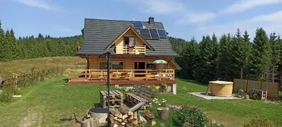 a house with solar panels on top of it at Gościniec Dziubasowki in Nowy Targ
