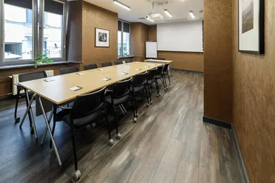 a conference room with a long table and chairs at Hotel Logos Kraków in Kraków
