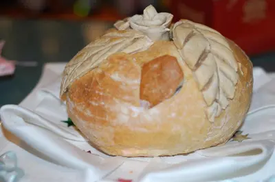 a loaf of bread sitting on top of a plate at Hotel Bona in Kraków