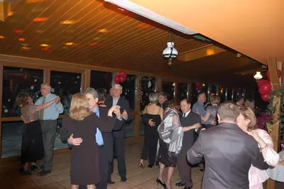 a group of people dancing at a party at Hotel Bona in Kraków