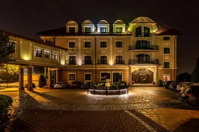 a large building at night with lights on it at Hotel Galicja Wellness & SPA in Oświęcim