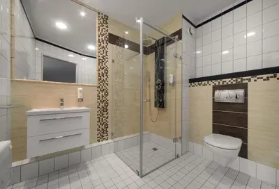 a bathroom with a shower and a toilet and a sink at Express Kraków Hotel in Kraków