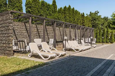 a row of lounge chairs lined up on a street at Express Kraków Hotel in Kraków