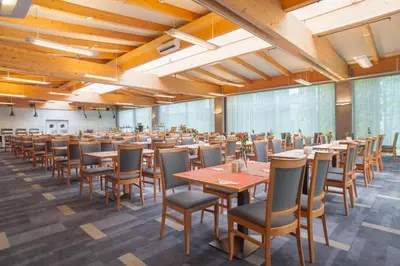 a large dining room with tables and chairs at Express Kraków Hotel in Kraków