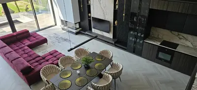 a living room with a table and a purple couch at Lake Park in Zator