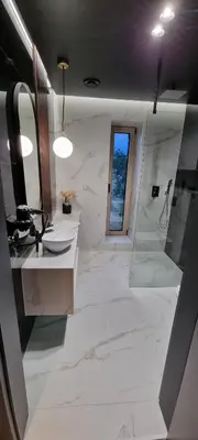 a white bathroom with a sink and a shower at Lake Park in Zator