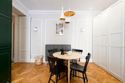 a dining room with a table and chairs at Native Apartments Nowowiejska 9 Deluxe in Kraków