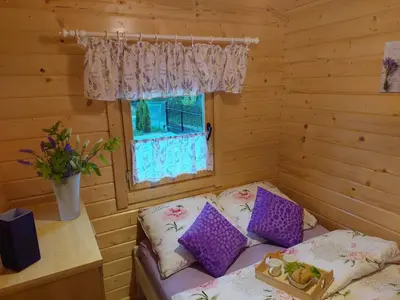 a small room with a couch and a window at Domek Kalilla in Bachowice