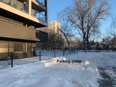 a pile of snow in front of a building at Pachecos' Garden in Kraków