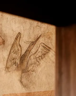 a drawing of two birds on a wall at Hotel Copernicus in Kraków
