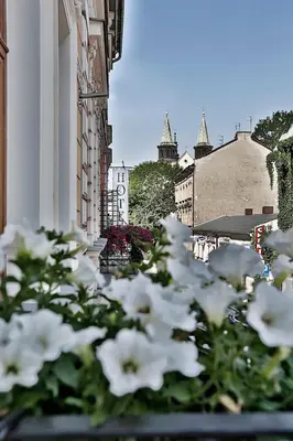 a patio with a lot of chairs and tables at Amber Boutique Hotels - Hotel Amber in Kraków