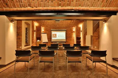 a conference room with a large table and chairs at Amber Boutique Hotels - Hotel Amber in Kraków