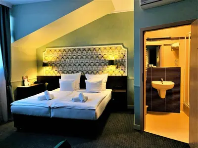 a large building with balconies on the side of it at Amber Boutique Hotels - Hotel Amber in Kraków
