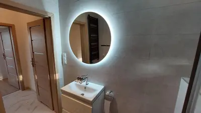 a bathroom with a sink and a mirror on the wall at Apartamenty Starowiejska 39, Ryczów - 10km od Zator Energylandia in Zator