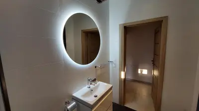 a bathroom with a sink and a mirror at Apartamenty Starowiejska 39, Ryczów - 10km od Zator Energylandia in Zator