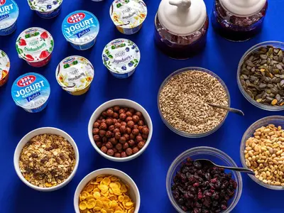 a table with bowls of different types of nuts and dried fruits at Kosmopolita Rooms in Kraków