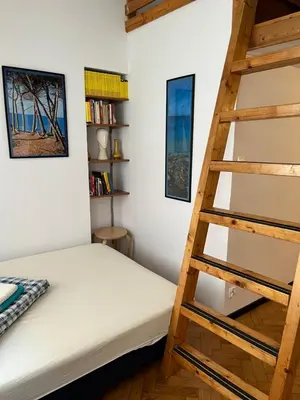 a bedroom with a bunk bed and a ladder at Home in Krakow Silvio's Apartments in Kraków