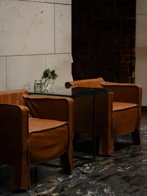 a dining room with wooden tables and chairs at Hotel Stary in Kraków