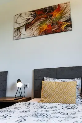 a kitchen and dining room with a table and chairs at Domki Całoroczne PREMIUM Zator ENERGYLANDIA in Zator