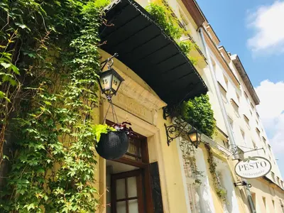 a building with plants on the side of it at Aparthotel Karmel in Kraków