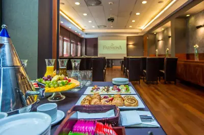 a table with food on it in a restaurant at Farmona Hotel Business & SPA in Kraków