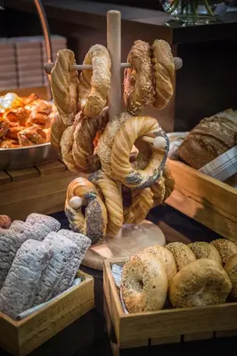 a display of bread and pastries in a bakery at Qubus Hotel Kraków in Kraków