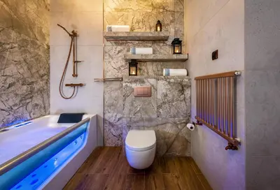 a bathroom with a tub and a toilet and a sink at Laurel White Apartment with Jacuzzi Bath and Pool Access in Kraków