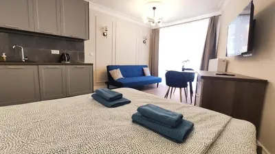 a bathroom with a sink and a toilet and a shower at Ariańska 8A by Homeprime in Kraków