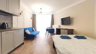 a room with a bed and a table and chairs at Ariańska 8A by Homeprime in Kraków