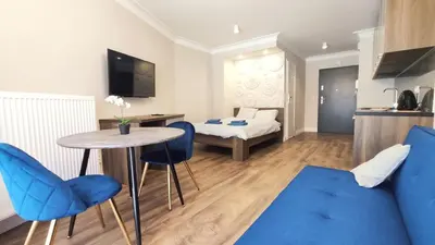 a kitchen with a sink and a bed in a room at Ariańska 8A by Homeprime in Kraków