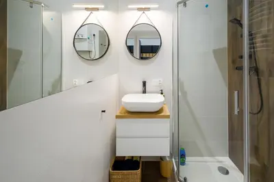 a bathroom with a sink and a shower at Powiśle 4 by Homeprime in Kraków