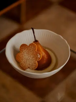 a bowl of honey with a flower on it at Hotel Pod Różą in Kraków