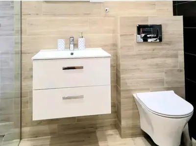 a bathroom with a white sink and a toilet at Cracow NOVUM Apartment Downtown 4 persons in Kraków