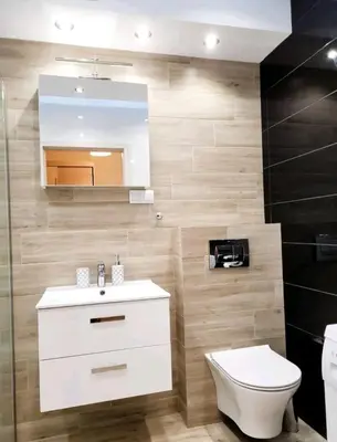 a bathroom with a sink and a toilet and a mirror at Cracow NOVUM Apartment Downtown 4 persons in Kraków