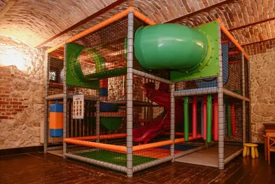 an indoor play room with a play structure at Dwór w Tomaszowicach in Modlnica