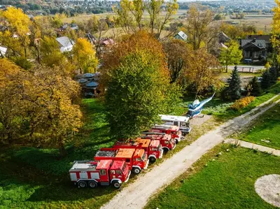 a row of fire trucks parked in a row at Dwór w Tomaszowicach in Modlnica