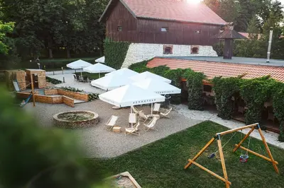 an aerial view of a backyard with a playground and picnic tables at Dwór w Tomaszowicach in Modlnica