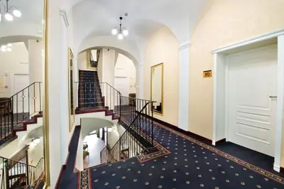 a view of a hallway with stairs in a building at Hotel Mikołaj in Kraków