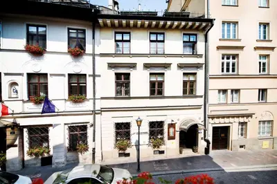 a large white building with lots of windows at Hotel Mikołaj in Kraków