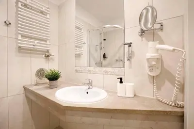 a white bathroom with a sink and a shower at Charming Apartment, Wawel & Old Town Krakow II in Kraków