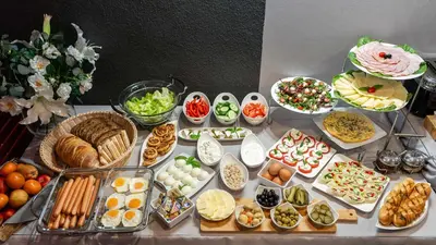 a table topped with lots of different types of food at Hotel Delta in Kraków